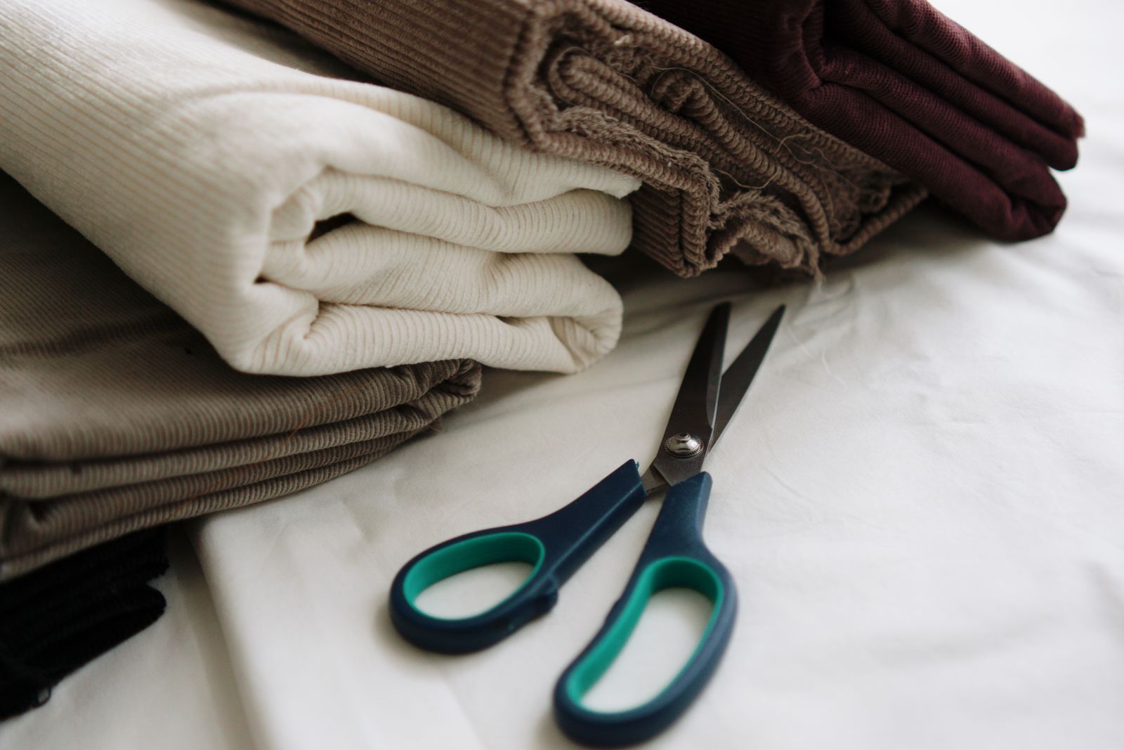 Folded woven fabrics and shears prepared for dress cutting