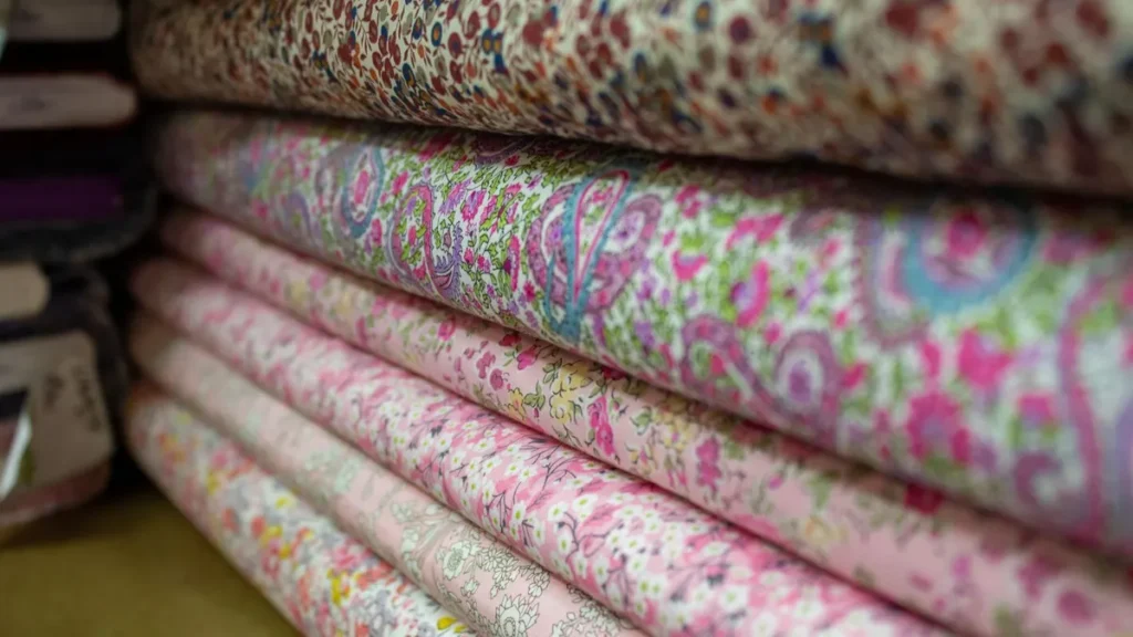 Stacked fabrics representing material quantity and colour decisions