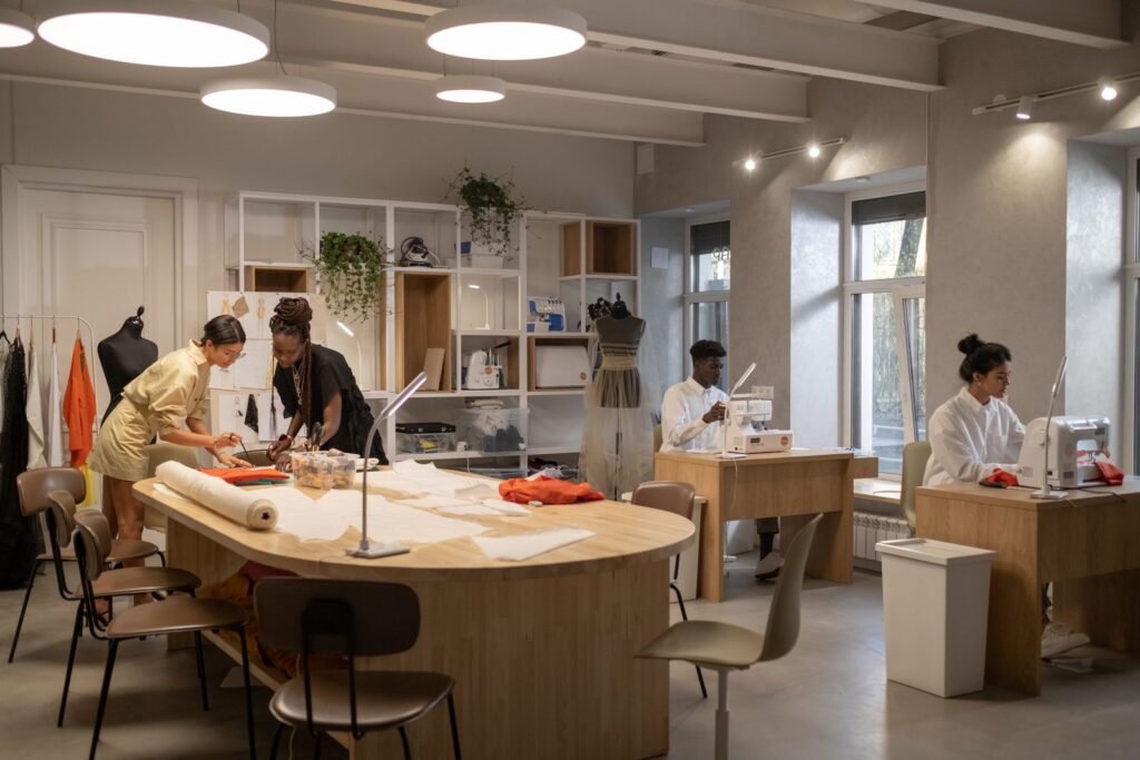 Fashion designers working together in a modern atelier